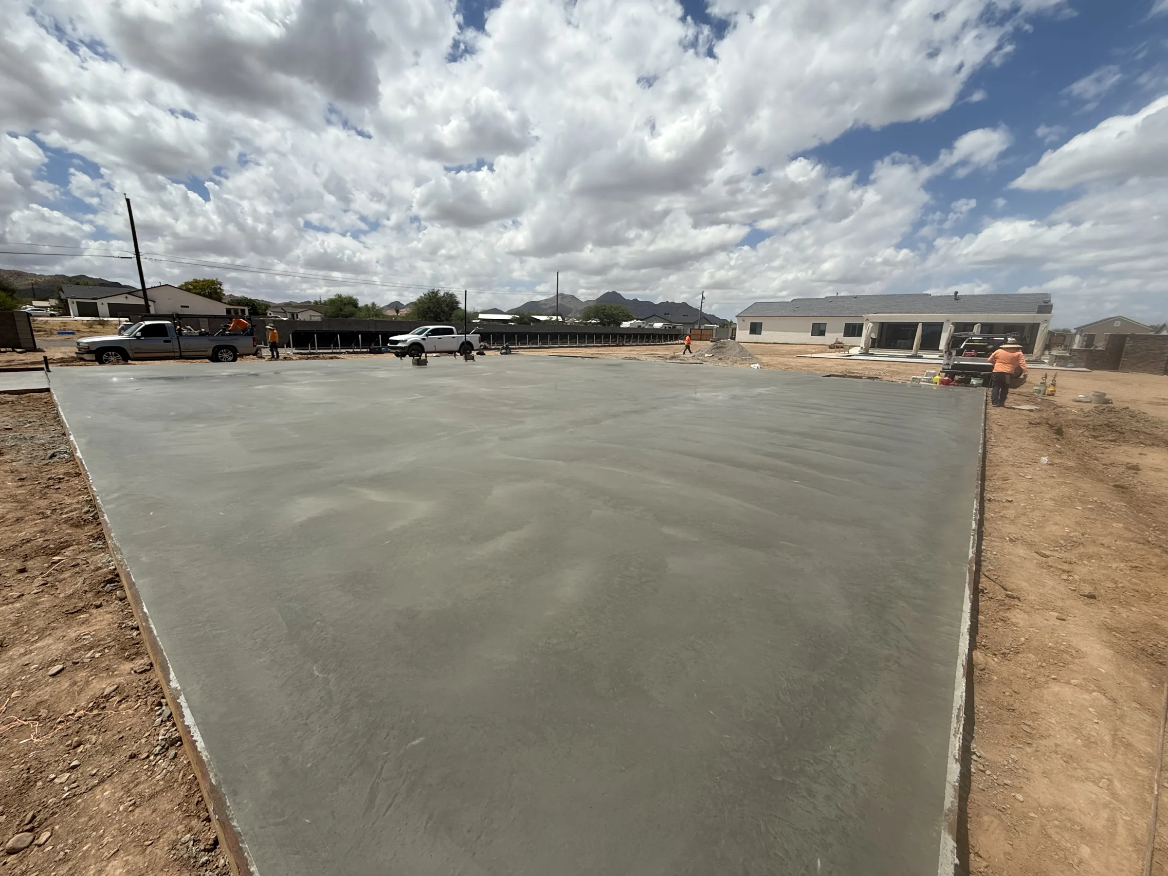 Finished, smooth concrete slab with the Superstition foothills on the horizon